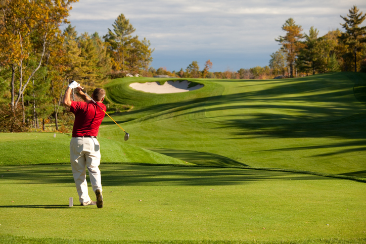 Golfer Driving off the Tee in Fall